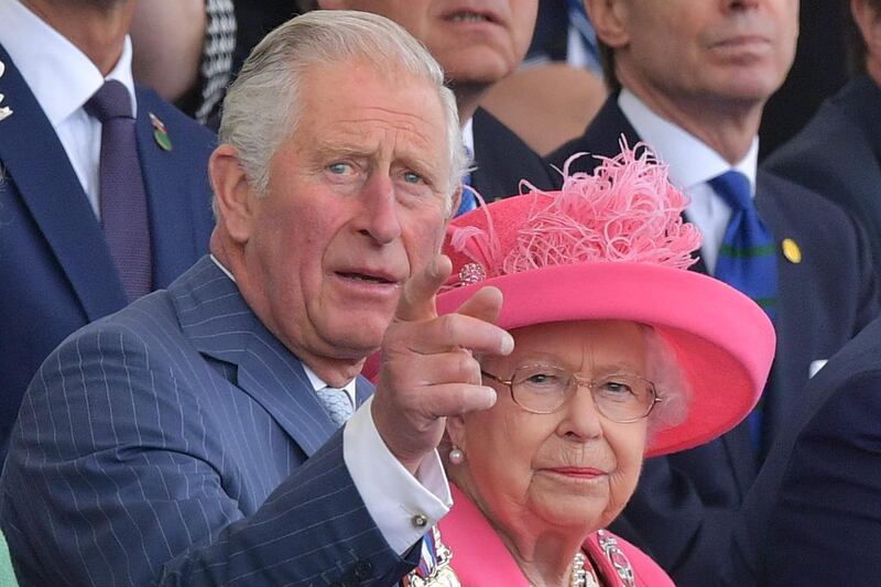 (L-R) Britain's Prince Charles, Prince of Wales, gestures as he speaks to Britain's Queen Elizabeth II (R) in the royal box during an event to commemorate the 75th anniversary of the D-Day landings, in Portsmouth, southern England.   AFP