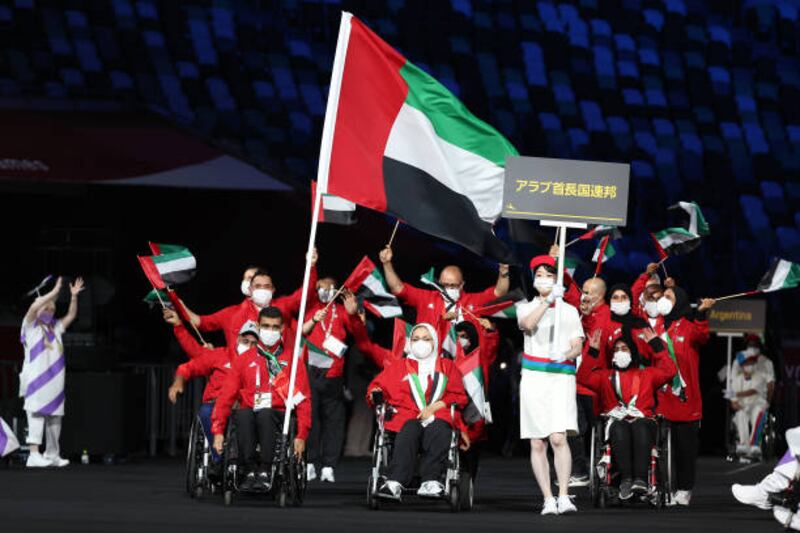 Mohamed Al Hammadi carries the flag for the UAE during the opening ceremony of the Tokyo 2020 Paralympic Games.