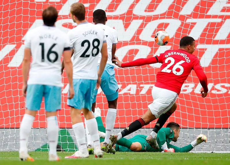 Manchester United's English striker Mason Greenwood celebrates after scoring the equalising goal. AFP
