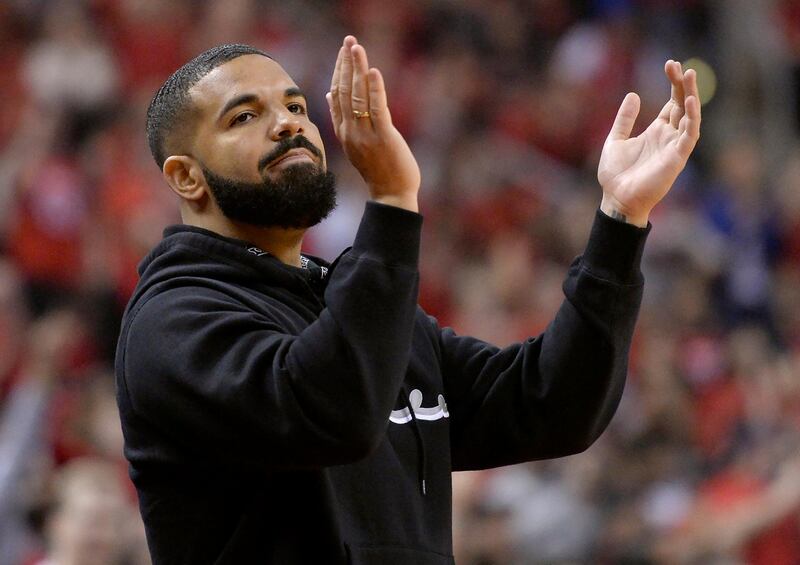 Drake cheers on the Raptors as they made history on Saturday. AP Photo