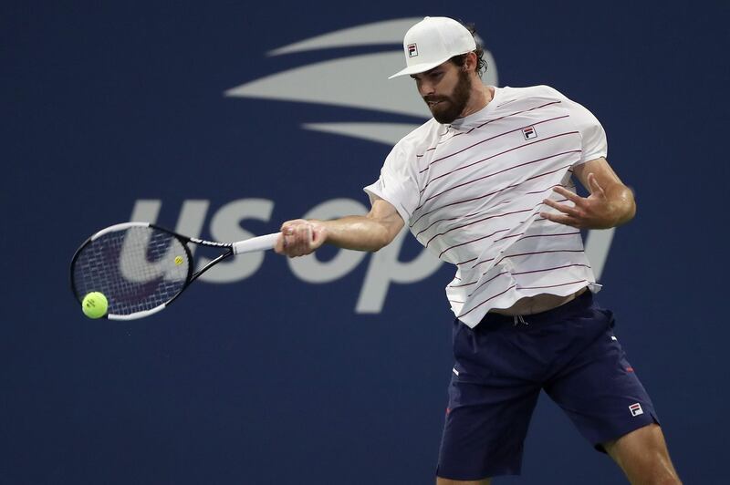 Reilly Opelka of the United States returns a shot during his Men's Singles first round match against David Goffin of Belgium.  AFP