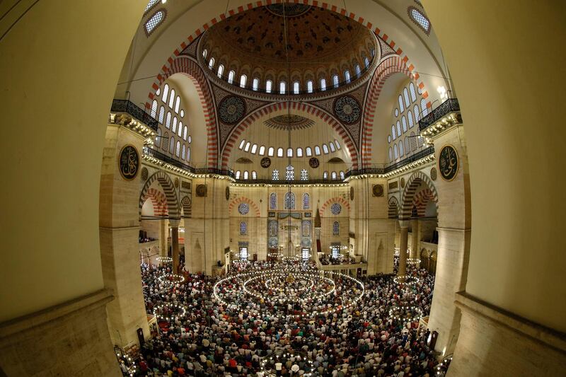 Muslims offer prayers during the first day of Eid Al Fitr at the Suleymaniye Mosque in Istanbul. Emrah Gurel / AP Photo