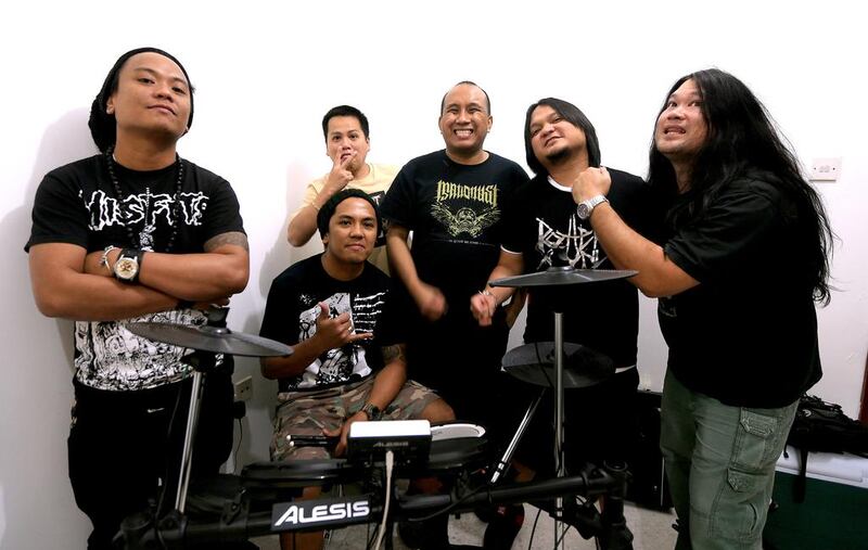 Members of the UAE-based Filipino six-piece grindcore band Maticrust, from left, Vincent, Paul, Don-Don, Erickson, Dennis and Kris at a rehearsal in Abu Dhabi. Ravindranath K / The National