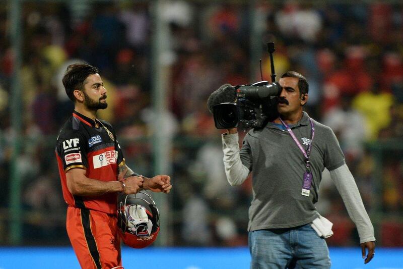 Royal Challengers Bangalore captain and batsman Virat Kohli walks back to the pavilion after the team’s victory during the 2016 Indian Premier League (IPL) Twenty20 cricket match between Royal Challengers Bangalore and Rising Pune Supergiants, at The M Chinnaswamy Stadium in Bangalore on May 7, 2016. Manjunath Kiran / AFP