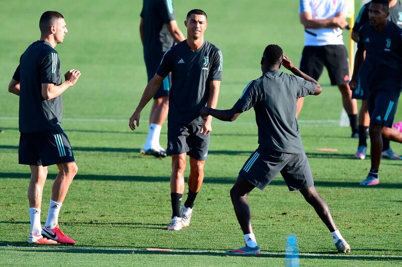 Cristiano Ronaldo training with teammates. AFP