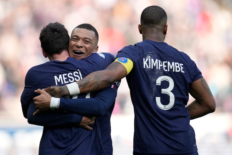 Lionel Messi, left, celebrates with his teammates Kylian Mbappe and Presnel Kimpembe after scoring. AP