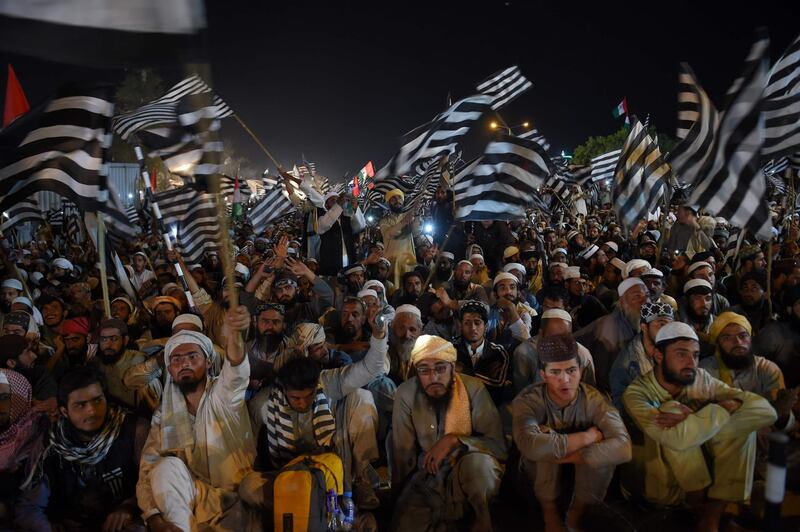 Supporters wave party flags. AFP