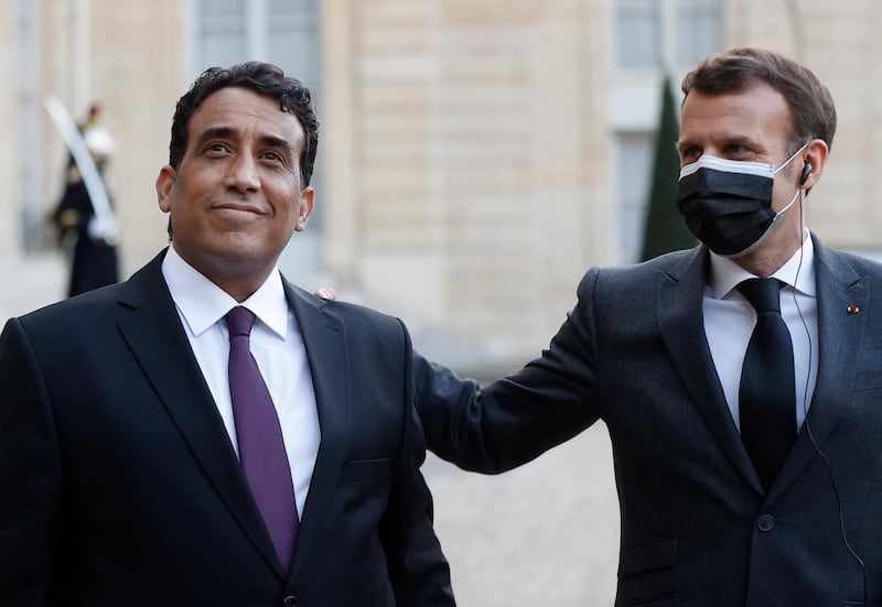 French President Emmanuel Macron and Head of Libya's Presidential Council, Mohamed al-Menfi hold a joint statement after a meeting at Elysee Palace in Paris, France. EPA