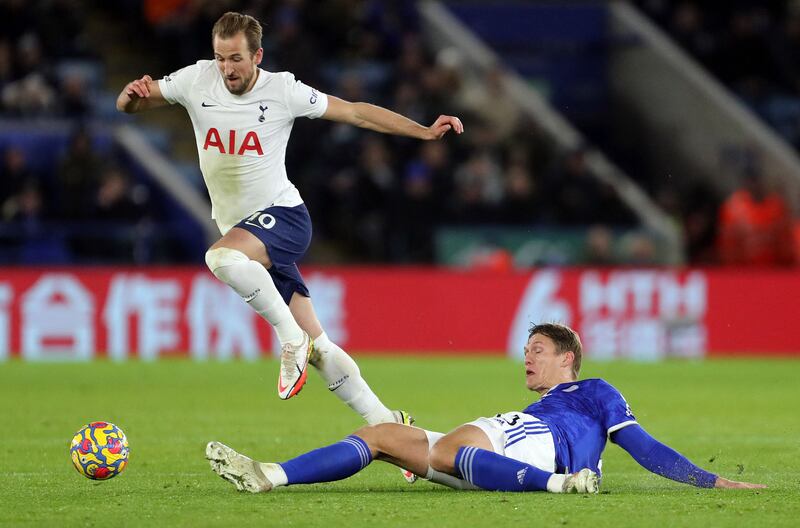 Harry Kane skips a challenge from Leicester defender Jannik Vestergaard. AFP