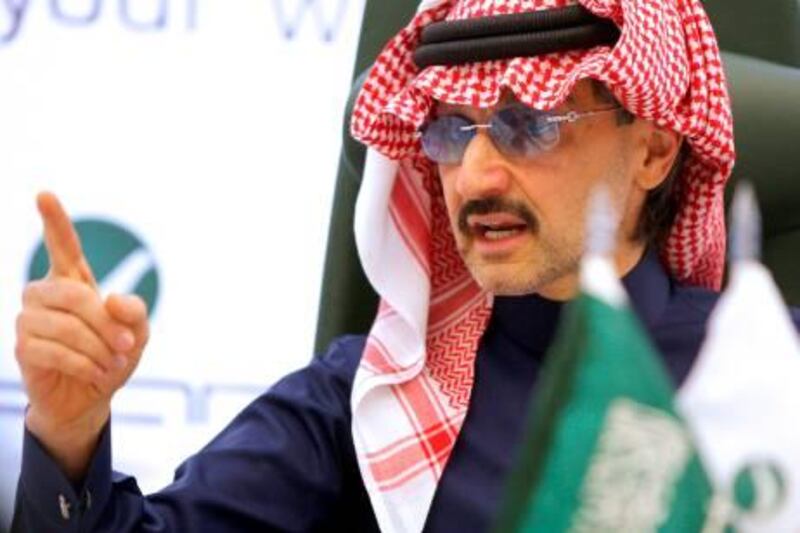 Saudi tycoon Prince Alwaleed bin Talal speaks during a prince conference in Riyadh on February 23, 2010. Global media giant News Corp has bought a 9.09-percent stake in Rotana Group, which is controlled by bin Talal, the companies said. AFPP HOTO/STR *** Local Caption ***  931948-01-08.jpg