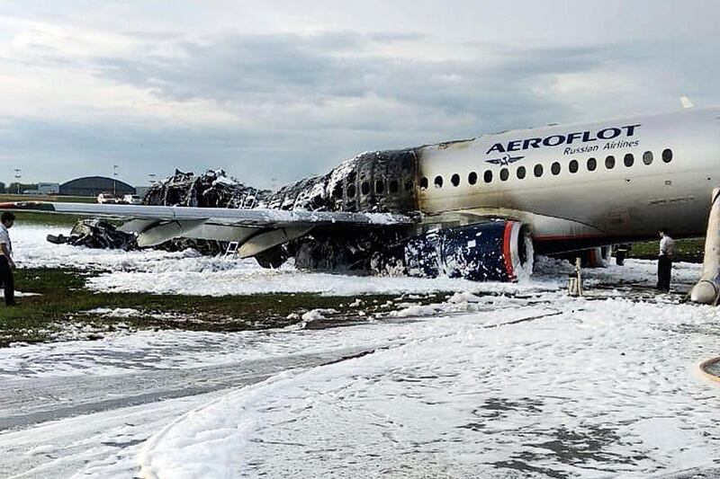 The Sukhoi Superjet 100 aircraft of Aeroflot Airlines covered in fire retardant foam. AP