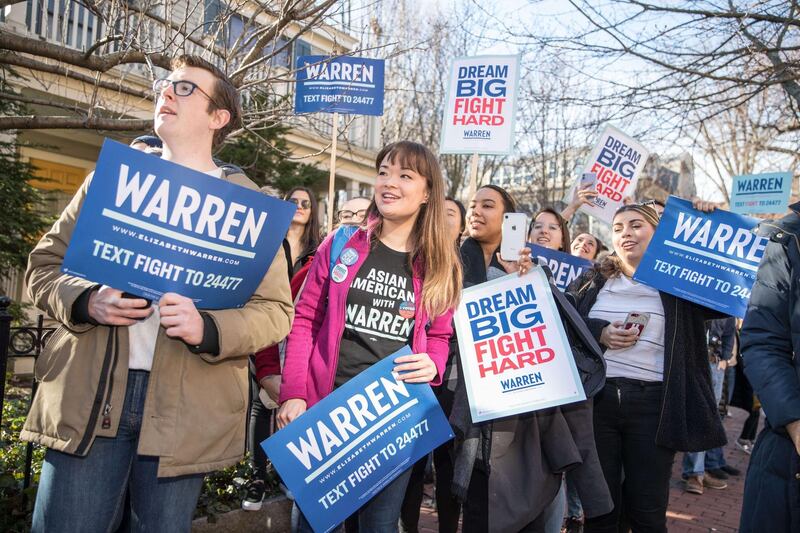 Supporters of Senator Elizabeth Warren watch as she approaches them before voting in the Primary Election in Cambridge, Massachusetts. AFP