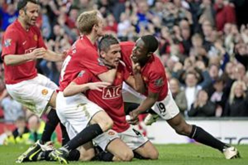 Federico Macheda, second right, is mobbed by United teammates after his dramatic winner last year.
