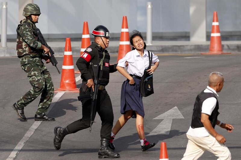 Soldiers evacuate a hostage from a mass shooting scene at the Terminal 21 shopping mall in Nakhon Ratchasima, Thailand.  EPA