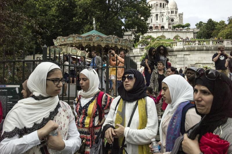 Muslim women wearing hijabs visit the Montmartre hill in Paris. Fred Dufour / AFP 