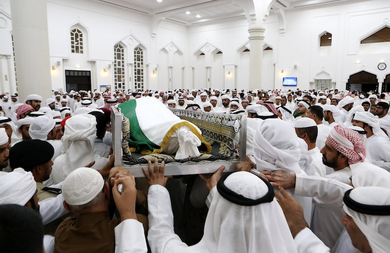 AJMAN , UNITED ARAB EMIRATES , AUG 12 – 2017 :- Family members and friends carrying the body of Sameer Mohammed Murad Abu Bakr , UAE solider who was killed in the helicopter crash in Yemen after the funeral prayers at the Sheikh Zayed Mosque in Ajman. ( Pawan Singh / The National ) Story by Nick Webster 