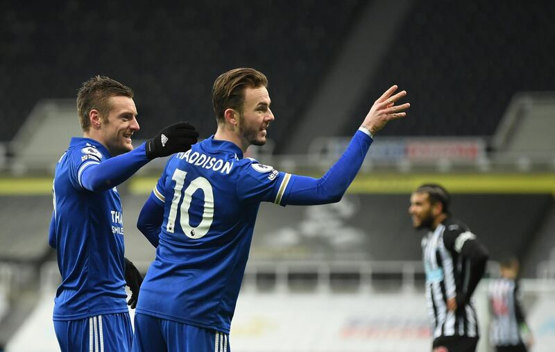 Leicester's James Maddison, centre, celebrates with Jamie Vardy after scoring his side's opening goal during the English Premier League soccer match between Newcastle United and Leicester City at St. James' Park in Newcastle, England, Sunday, Jan. 3, 2021. (Michael Regan/Pool via AP)