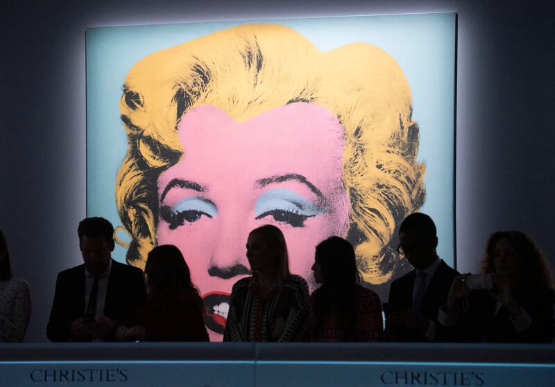 Staff who will be handling bids over the phone take their places before The Evening Sale of works from The Collection of Thomas and Doris Amman at Christie's Auction House in New York, New York, USA, 09 May 2022.   EPA / SARAH YENESEL