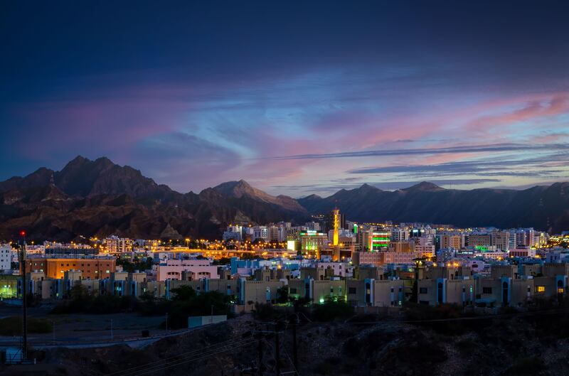Evening in Muscat. The Oman Investment Authority's latest initiative sets out to strengthen the private sector and small and medium-size businesses. Photo: Alamy