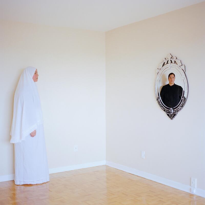 Her work often investigated the duality of Muslim identity in the West. 'Mirror Mirror Allah Allah' (2012) shows two depictions of Abouon