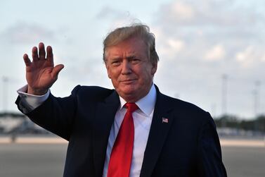 US President Donald Trump waves upon arrival at Palm Beach International airport, Florida on April 18, 2019. AFP