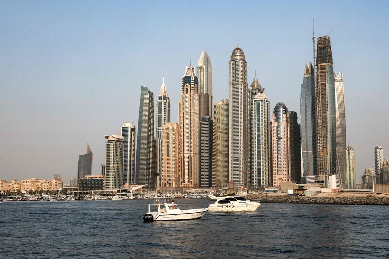 Boats moored in front of Dubai Marina skyscrapers. The emirate's transportation and storage sector, including maritime, outperformed all other sectors AFP