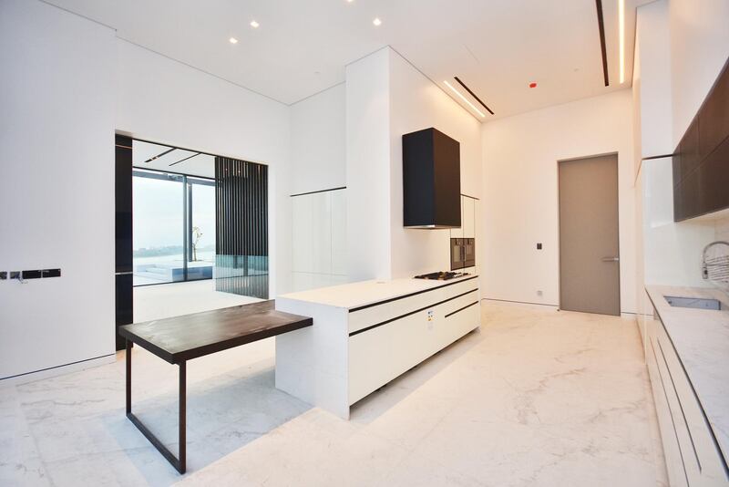 <p>The kitchen is sleek and spacious.&nbsp;Courtesy LuxuryProperty.com</p>
