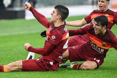 Roma's Italian defender Gianluca Mancini (L) celebrates after scoring an equalizer during the Italian Serie A football match AS Rome vs Inter Milan on January 10, 2021 at the Olympic stadium in Rome. / AFP / Vincenzo PINTO