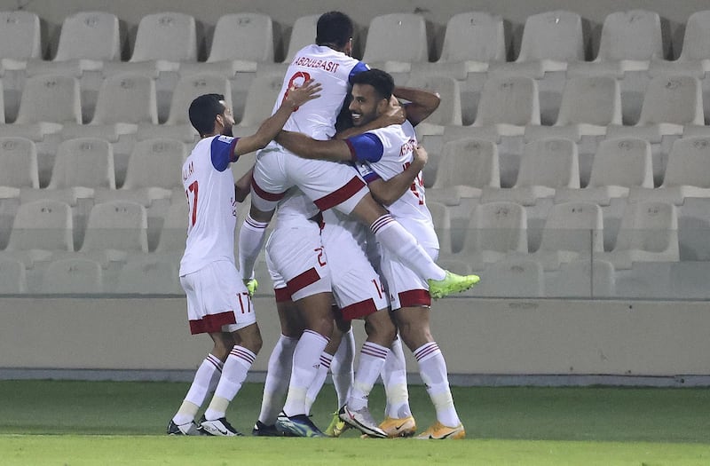 Sharjah's players celebrate another goal. AFP