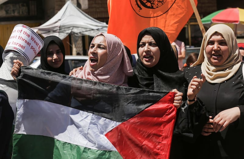 Palestinian protesters shout slogans as they take part in a demonstration against Israel's plans to annex parts of the occupied West Bank, in Khan Yunis in the southern Gaza Strip. AFP