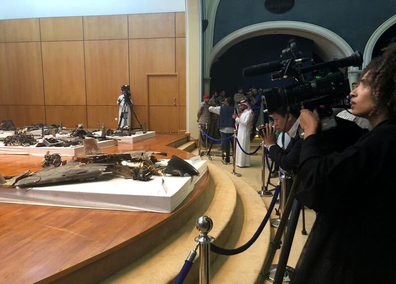 Journalists look at drone wreckage said to be from the attack on the Aramco Aquaiq oil refinery displayed during a Ministry of Defense news conference in Riyadh, Saudi Arabia, on Wednesday, September 18, 2019.Bloomberg