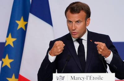 French President Emmanuel Macron gestures as he speaks at French drugmaker's vaccine unit Sanofi Pasteur plant in Marcy-l'Etoile, near Lyon, central France, on June 16, 2020. The visit comes after rival pharmaceutical company this weekend announced a deal to supply 400 million vaccine doses to EU countries, including France.  / AFP / POOL / Laurent Cipriani
