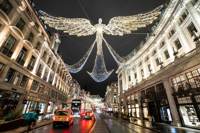 Christmas lights shine above Regent Street, central London. All photos: AP