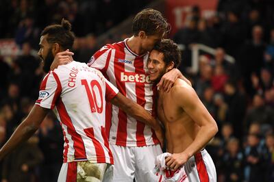 STOKE ON TRENT, ENGLAND - DECEMBER 23:  Ramadan Sobhi of Stoke City celebrates with teammates Maxim Choupo-Moting and Peter Crouch after scoring his sides third goal during the Premier League match between Stoke City and West Bromwich Albion at Bet365 Stadium on December 23, 2017 in Stoke on Trent, England.  (Photo by Gareth Copley/Getty Images)