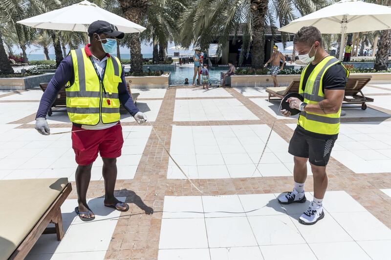 RAS AL KHAIMAH, UNITED ARAB EMIRATES. 21 MAY 2020. A tour with RAK Tourism Development Authority inspectors to know more about Hilton Ras Al Khaimah  Resort & Spa’s preventive and hygiene measures as they open up after the hotel lockdown. Leisure and health staff at the hotel make sure that guests maintain a safe distance while accessing the public ares like the swimmingpool and beach. (Photo: Antonie Robertson/The National) Journalist: Ruba Haza. Section: National.