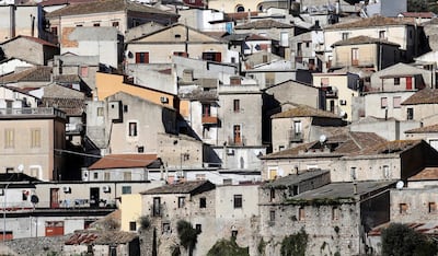 The town of Riace is seen in the southern Italian region of Calabria November 22, 2013. Riace is a small village in Calabria, a poor region in the south of Italy. Many of the village's former residents left in search of better opportunities elsewhere in Italy or abroad. In recent years, however, the mayor Domenico Lucano has introduced a scheme to encourage immigrants to come to Riace and breathe new life into the village. The immigrant's children have revitalized the local school, which suffered from a lack of students. Picture taken November 22, 2013. REUTERS/Max Rossi  (ITALY- Tags: POLITICS SOCIETY IMMIGRATION)

ATTENTION EDITORS: PICTURE 02 OF 25 FOR PACKAGE 'THE CHANGING FACE OF ITALY'. 
SEARCH 'RIACE ROSSI' FOR ALL PICTURES PXP101-PXP125 - Tags: POLITICS SOCIETY IMMIGRATION) - GM1EA2P0JEV01