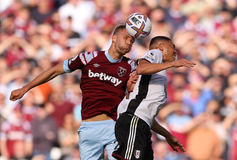 Tomas Soucek of West Ham challenges for a header with Fulham's Carlos Vinicius. Getty