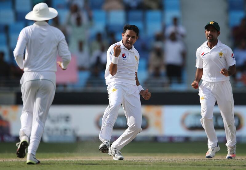 Pakistan's Mohammad Abbas, center, celebrates after taking the wicket of Australia's Aaron Finch during their test match in Dubai, United Arab Emirates, Wednesday, Oct. 10, 2018. (AP Photo/Kamran Jebreili)