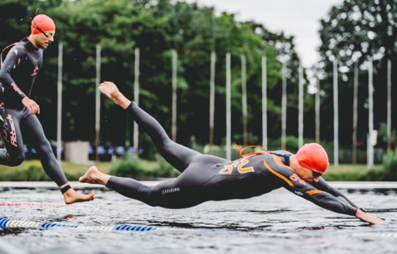 An athlete competes in the swim leg of the IRONMAN 70.3 Duisburg in Germany on Sunday, August 29. Getty