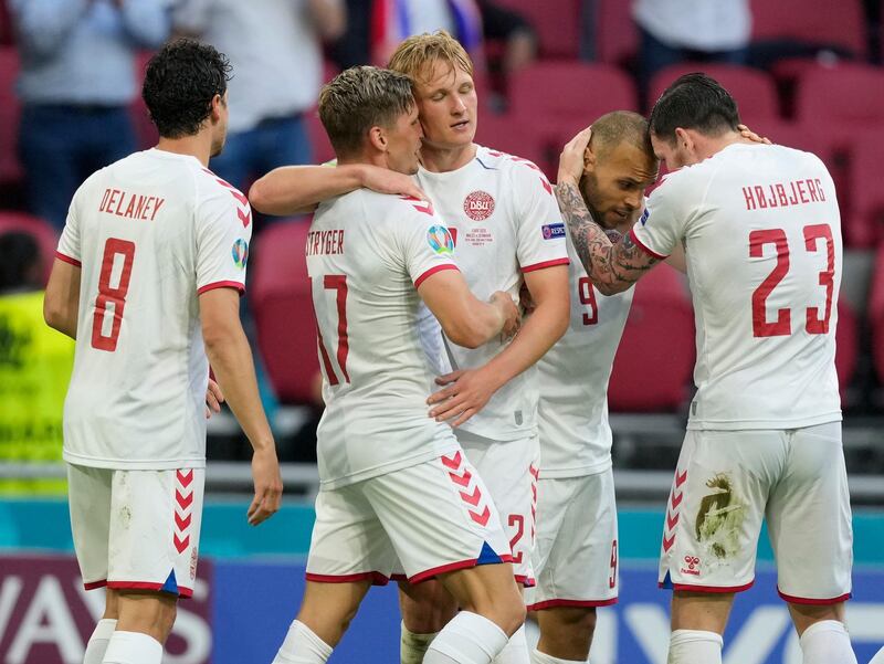 Denmark's Kasper Dolberg, centre, celebrates with teammates after scoring his sides second goal during the Euro 2020 round of 16 match against Wales and Denmark in Amsterdam, Netherlands, on Saturday, June 26, 2021. AP