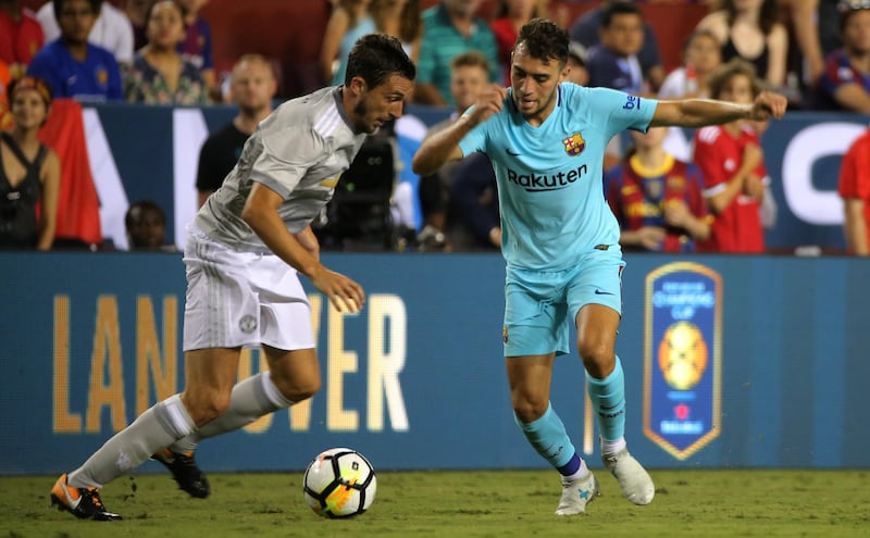 Barcelona's Munir El Haddadi in action with Manchester United's Matteo Darmian. Carlos Barria / Reuters