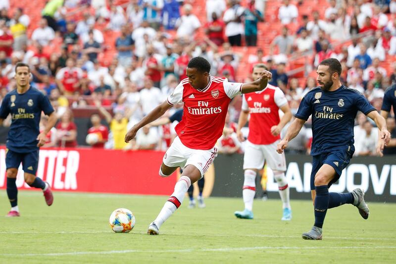 Arsenal's Joe Willock kicks the ball as Real Madrid defender Daniel Carvajal defends. Reuters