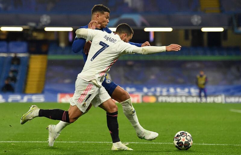 Chelsea's defender Thiago Silva fends off Real Madrid's forward Eden Hazard. AFP