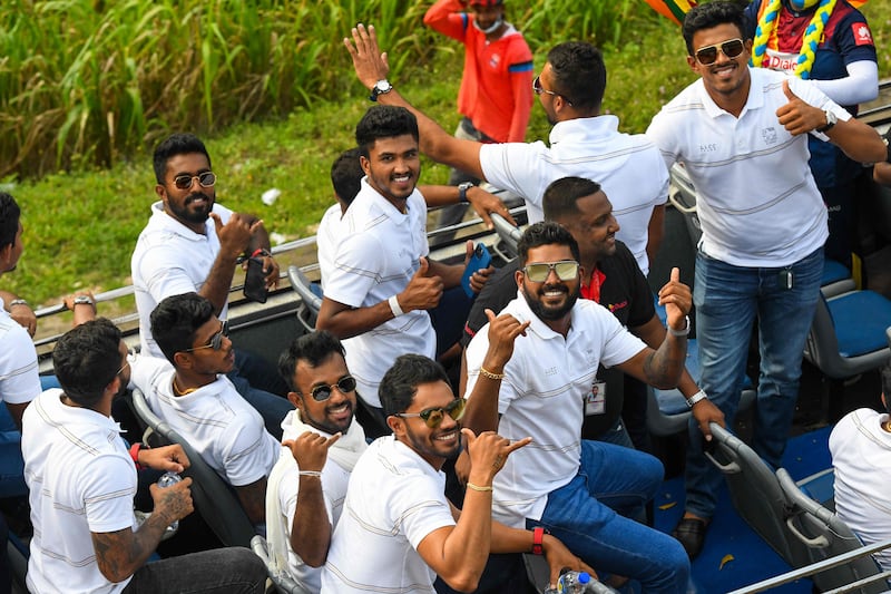 Sri Lankan players during an open-top bus parade after arriving in Colombo. They defeated Pakistan in the final to win the Asia Cup. AFP