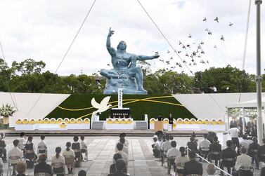 Doves fly over the Statue of Peace during a ceremony at Nagasaki Peace Park in Nagasaki to mark the 75th anniversary of the world's second atomic bomb attack. AP