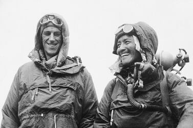 Sardar Tenzing Norgay, right, of Nepal and Edmund Hillary of New Zealand, left, show off the kit they wore when conquering Mount Everest, at the British Embassy in Katmandu on June 26, 1953. AP 