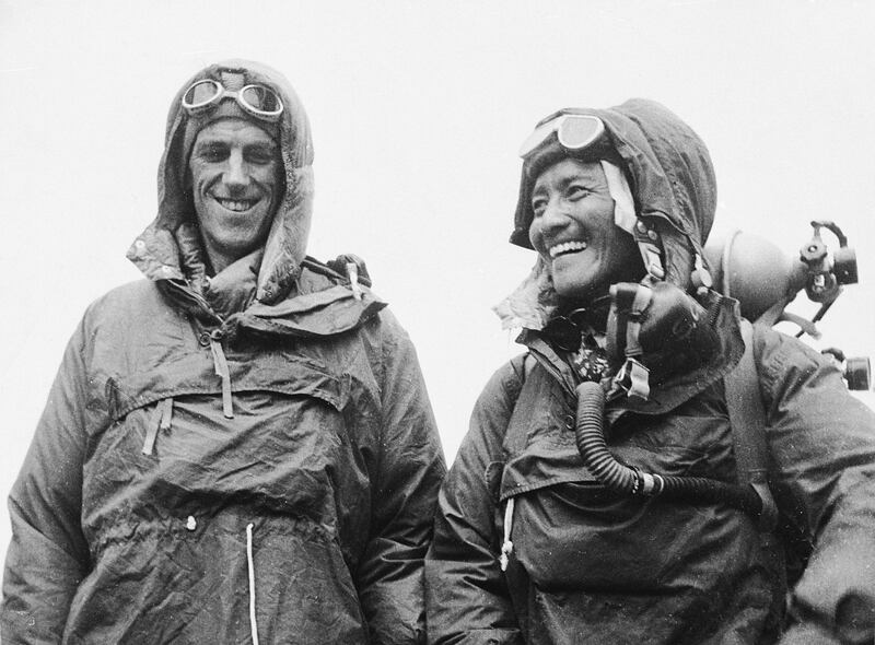 Sardar Tenzing Norgay, right, of Nepal and Edmund P. Hillary of New Zealand, left, show the kit they wore when conquering the world's highest peak, Mount Everest, at the British Embassy in Katmandu, capital of Nepal, on June 26, 1953.  Edmund Hillary,  with Sherpa Tenzing Norgay, reached the 29,035-foot summit of Everest on May 29, 1953, becoming the first person to stand atop the world's highest mountain. (AP Photo)