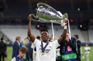 PARIS, FRANCE - MAY 28: Vinicius Junior of Real Madrid celebrates with the UEFA Champions League Trophy after their sides victory in the UEFA Champions League final match between Liverpool FC and Real Madrid at Stade de France on May 28, 2022 in Paris, France. (Photo by Catherine Ivill / Getty Images)