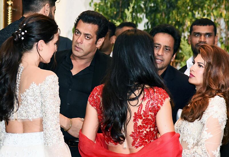 Indian Bollywood actors Isabelle Kaif (L), Salman Khan (2L), Katrina Kaif (C) and Jacqueline Fernandez (R) at the wedding reception of actress Sonam Kapoor and businessman Anand Ahuja in Mumbai late on May 8, 2018. AFP PHOTO / Sujit Jaiswal