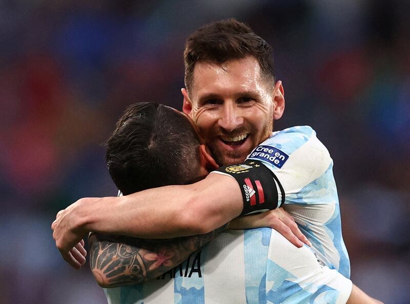 Argentina's Angel Di Maria celebrates scoring their second goal with Lionel Messi. Reuters